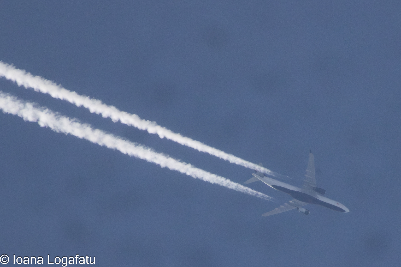 Sky travelers leave trails across the blue expanse